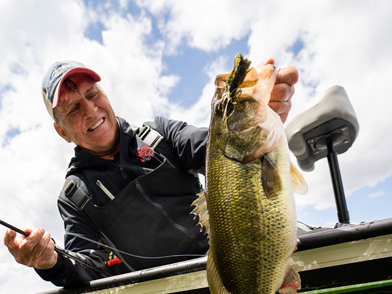 Mike Frisch lands a big bass that ate a jig.